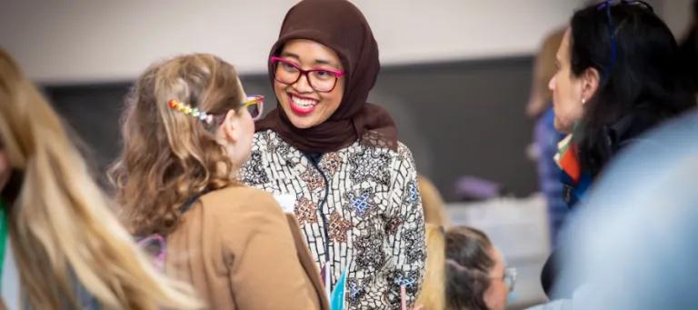 two students talking and smiling 